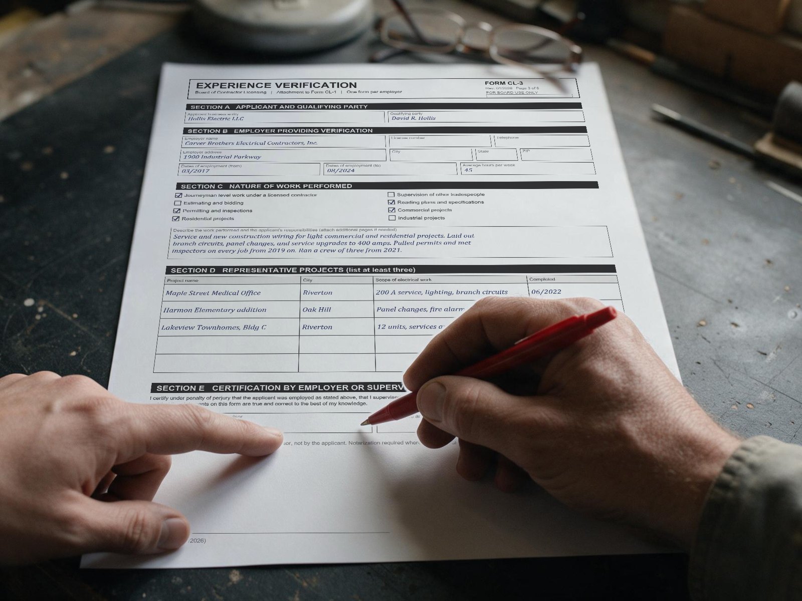 A reviewer checks an experience verification form before it goes to the board