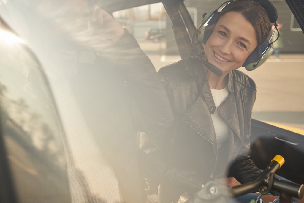 Passenger smiling in helicopter