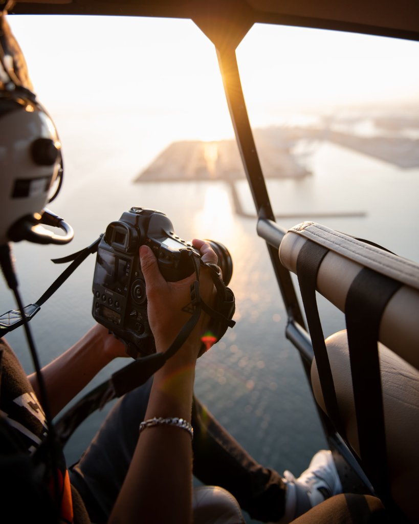Photographer filming from helicopter