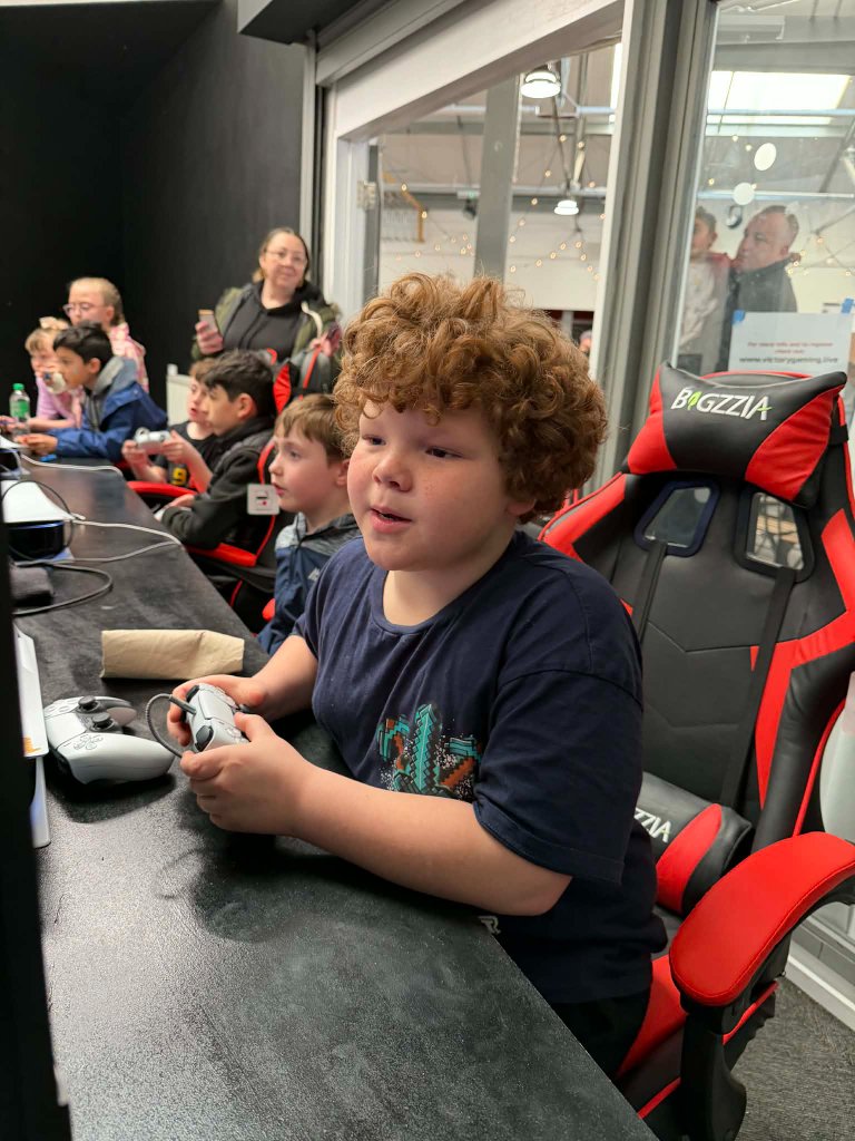 Young gamer focused during a session at Victory Gaming