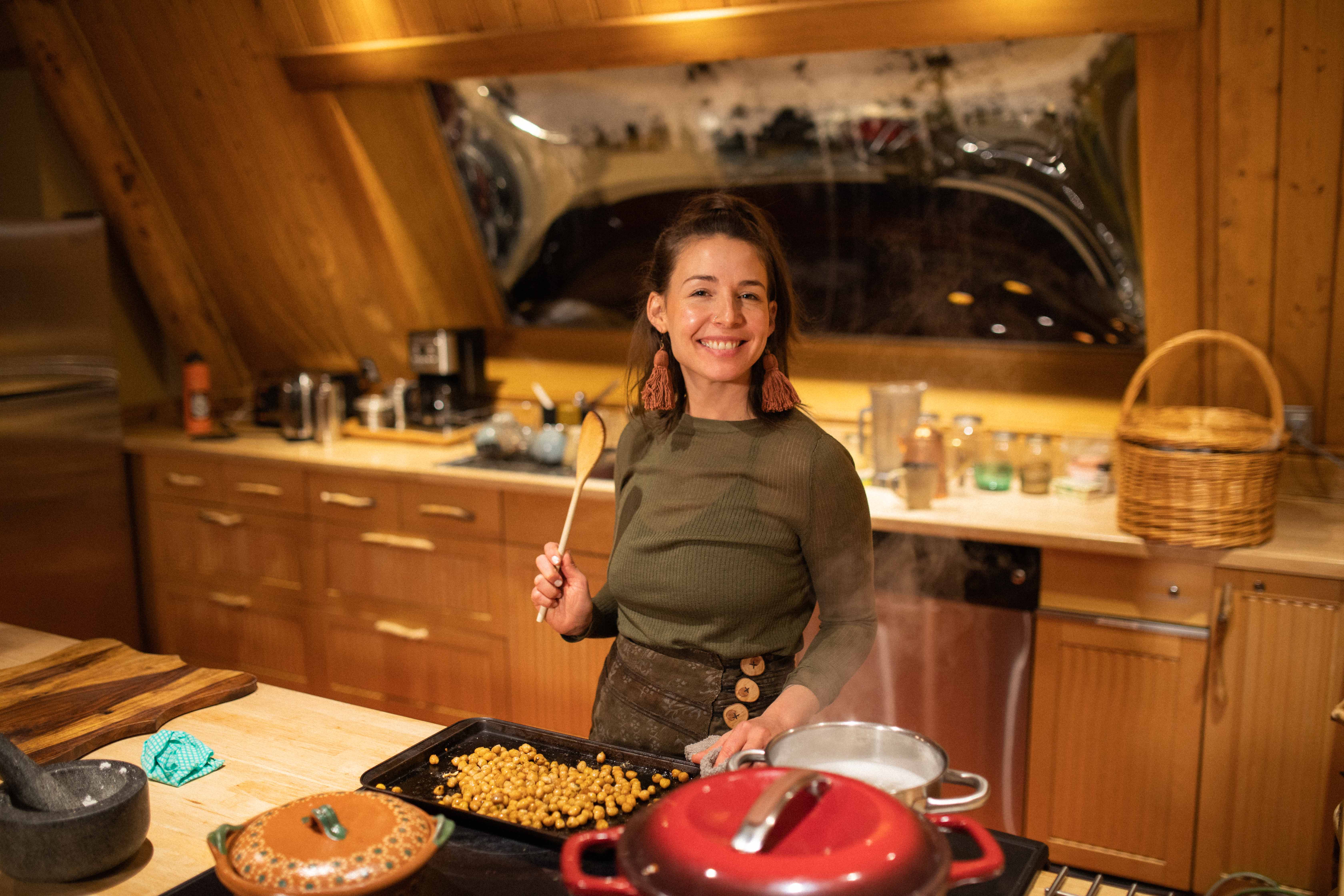 Chef cooking at a timber kitchen island
