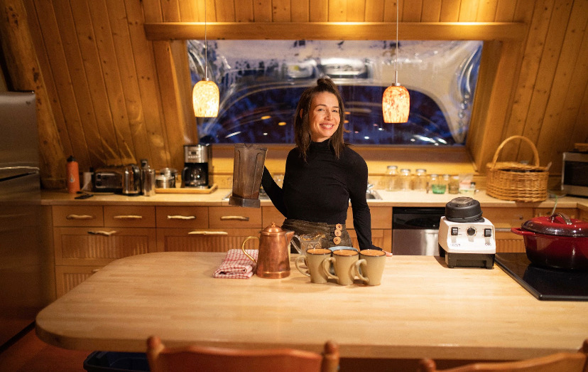 Chef at the kitchen island with mugs and a blender