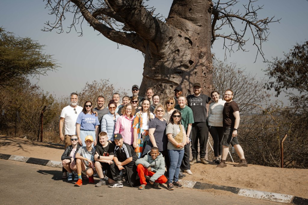 Zambia Outreach 2026 Team in front of a baobab tree