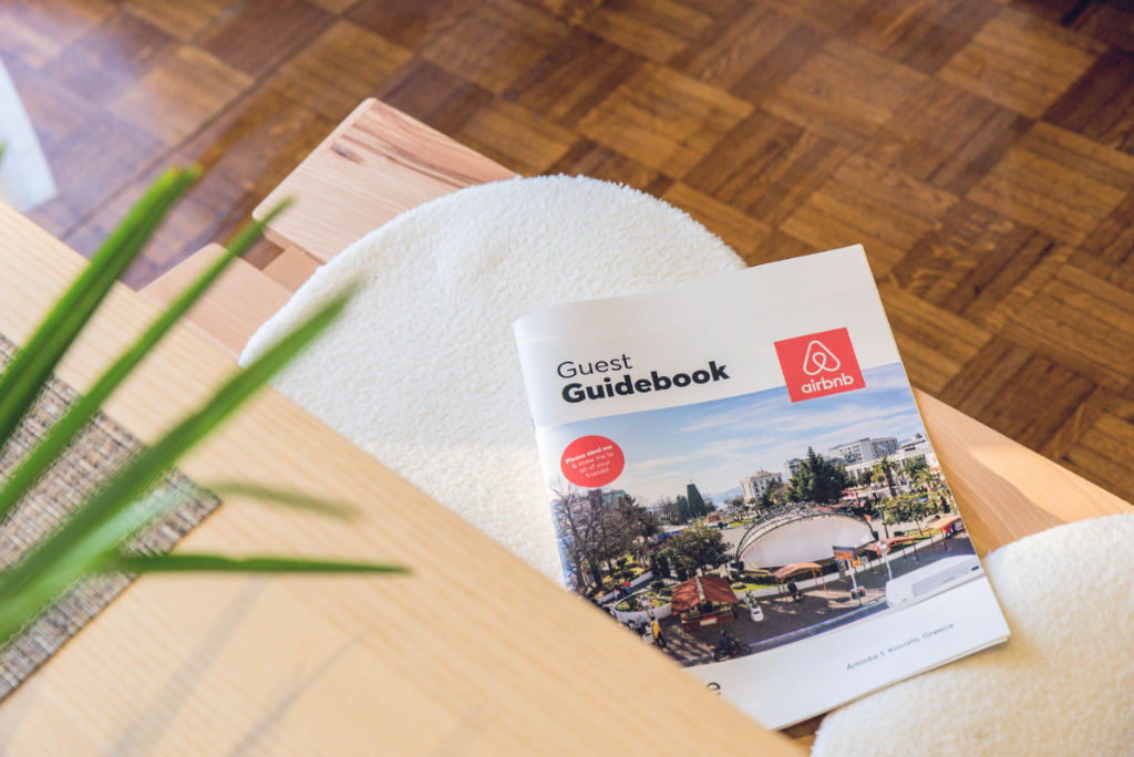 Airbnb guest guidebook on a vacation rental coffee table