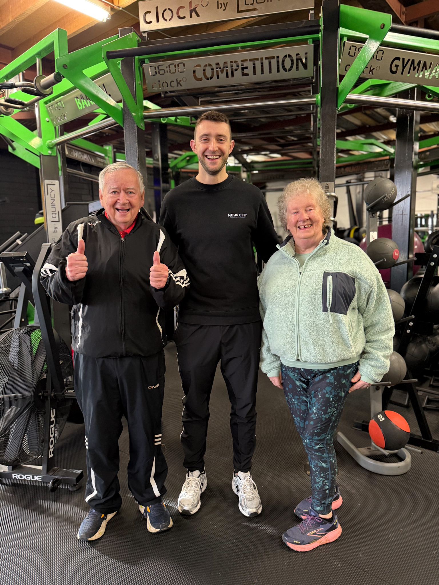 Older adults working on strength and balance with a NeuroFit coach