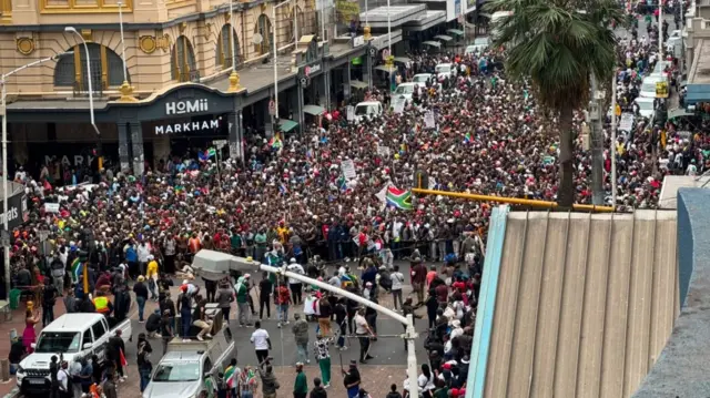 Large public gathering reflecting public concern about immigration governance