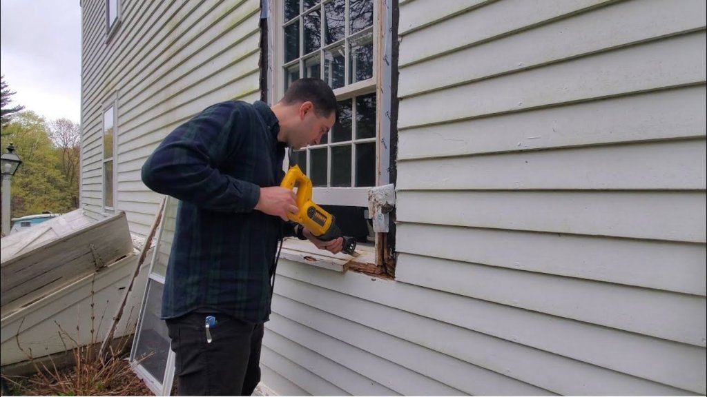 Professional window repair and installation in progress