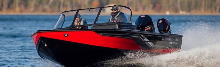 Red and black Crestliner fishing boat under power