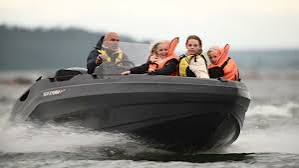 Sea Storm boat cruising with family aboard