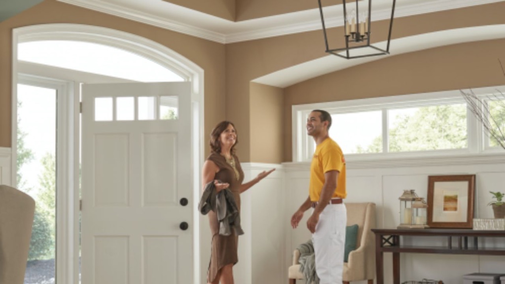 Painter walking a homeowner through a finished entryway