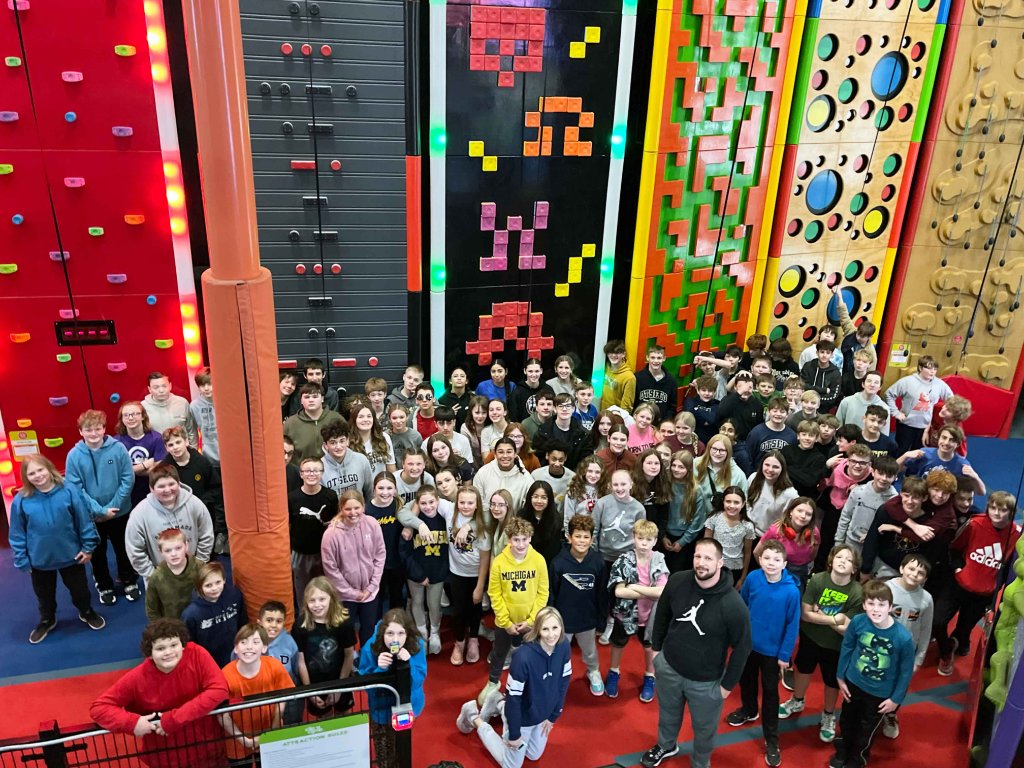 Otsego Public Schools field trip group photo at Allegan Event climbing walls