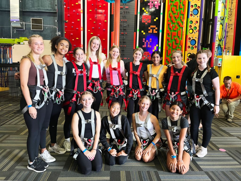 Kalamazoo Kinetic Synchronized Skating Team wearing harnesses at Allegan Event