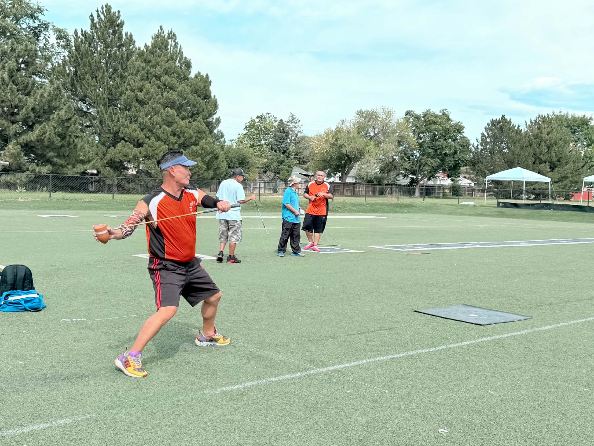 A player throwing during Hmong top spin