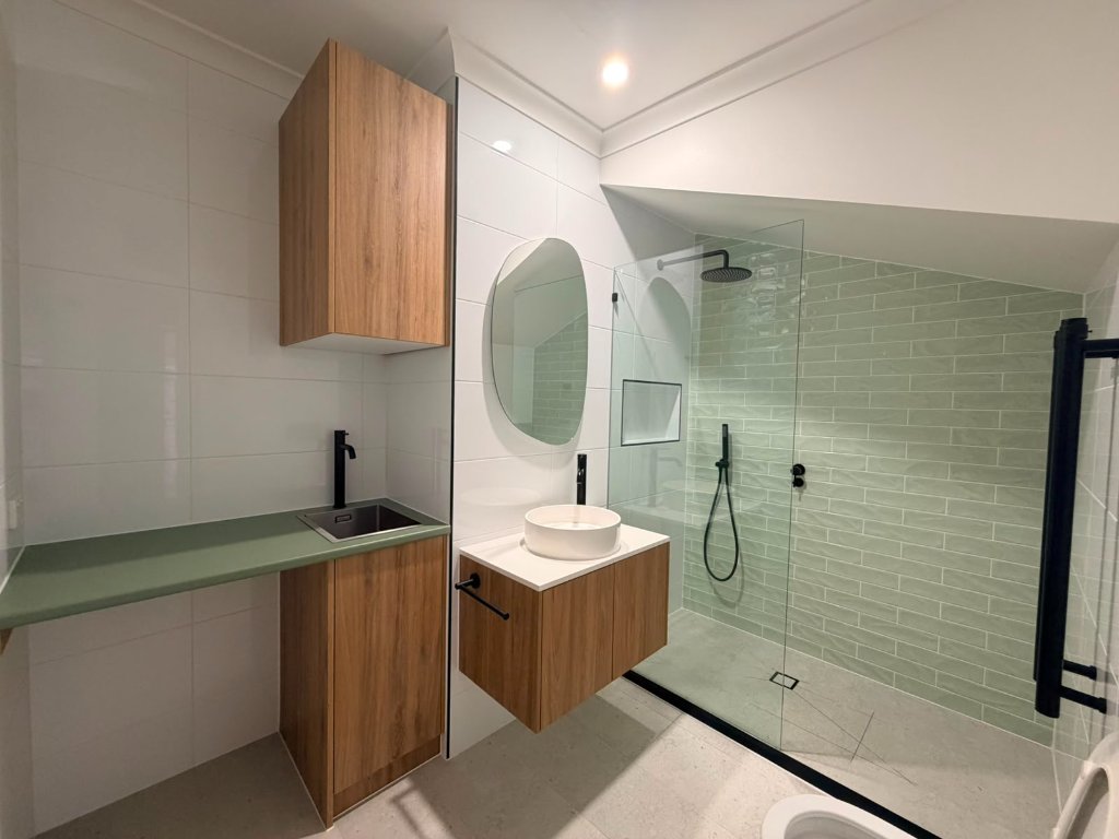 Small bathroom renovation in Melbourne maximising space with walk-in shower and custom storage solutions