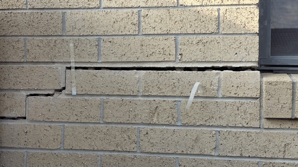 Severe structural cracking in brick wall requiring building rectification — Melbourne