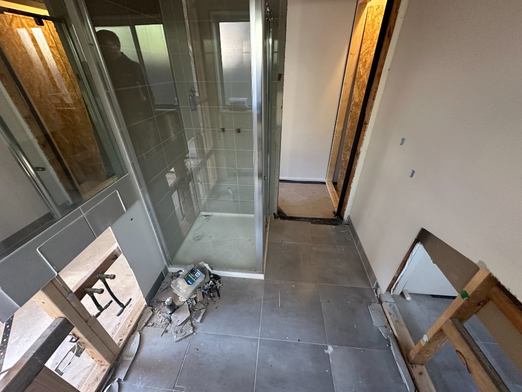 Bathroom with failed waterproofing and building defects being assessed for rectification — Melbourne