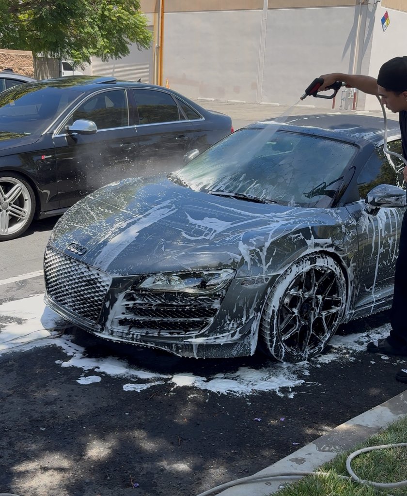 Foam rinse on an Audi R8 during a Polish Theory Refresh maintenance detail