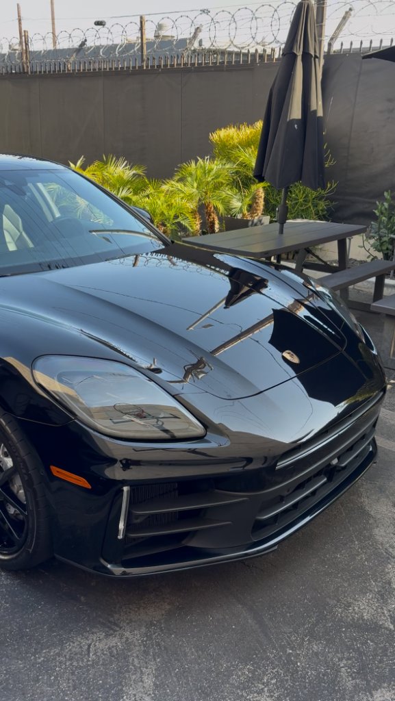 Deep gloss on black Porsche paint after a decontamination and wax by Polish Theory