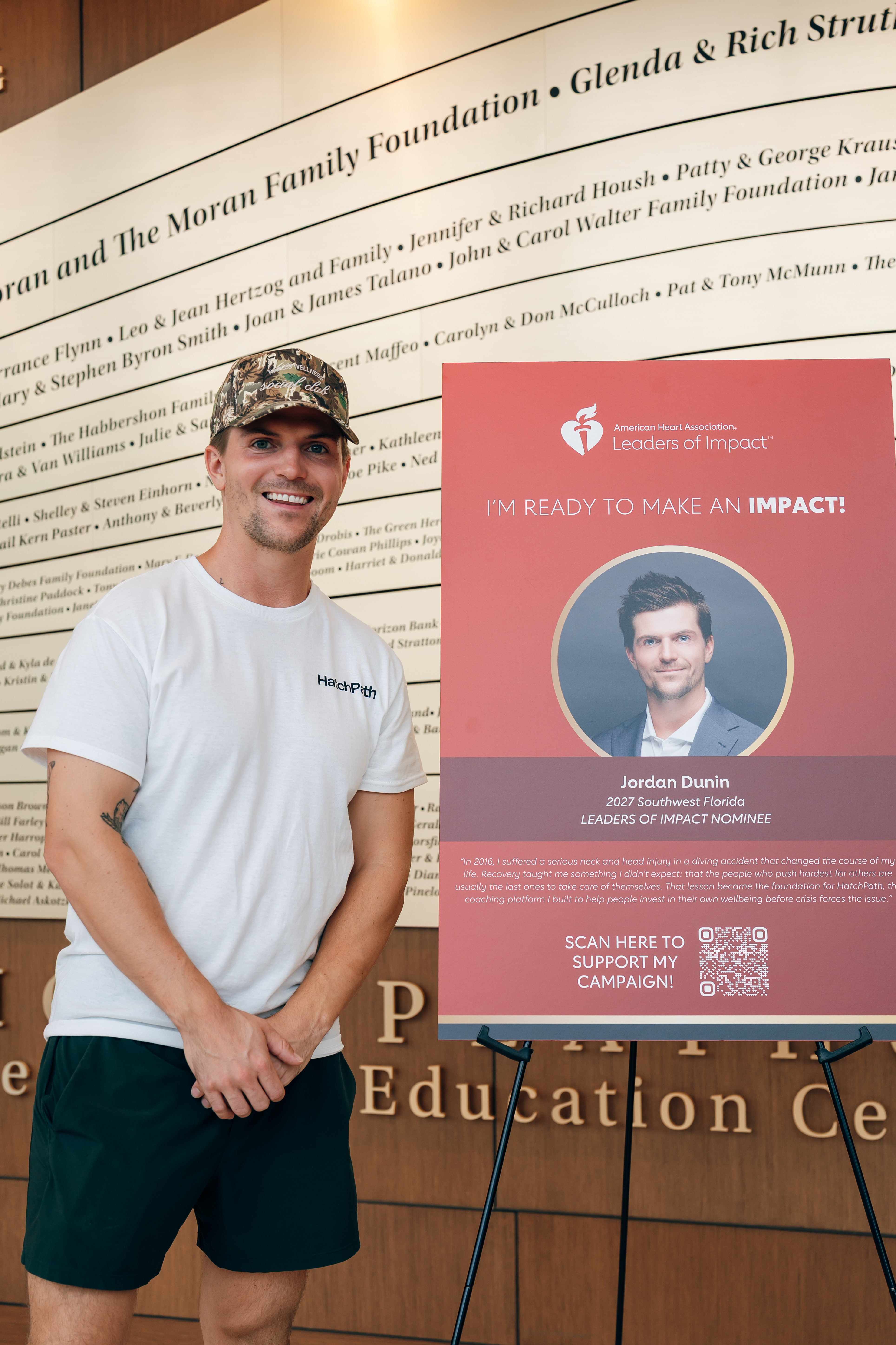 Jordan with his Leaders of Impact campaign display at the Gulfshore Playhouse donor wall.
