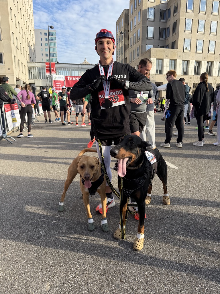 Kyle running with his dogs
