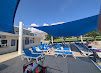 Shaded lounge area overlooking the pool deck