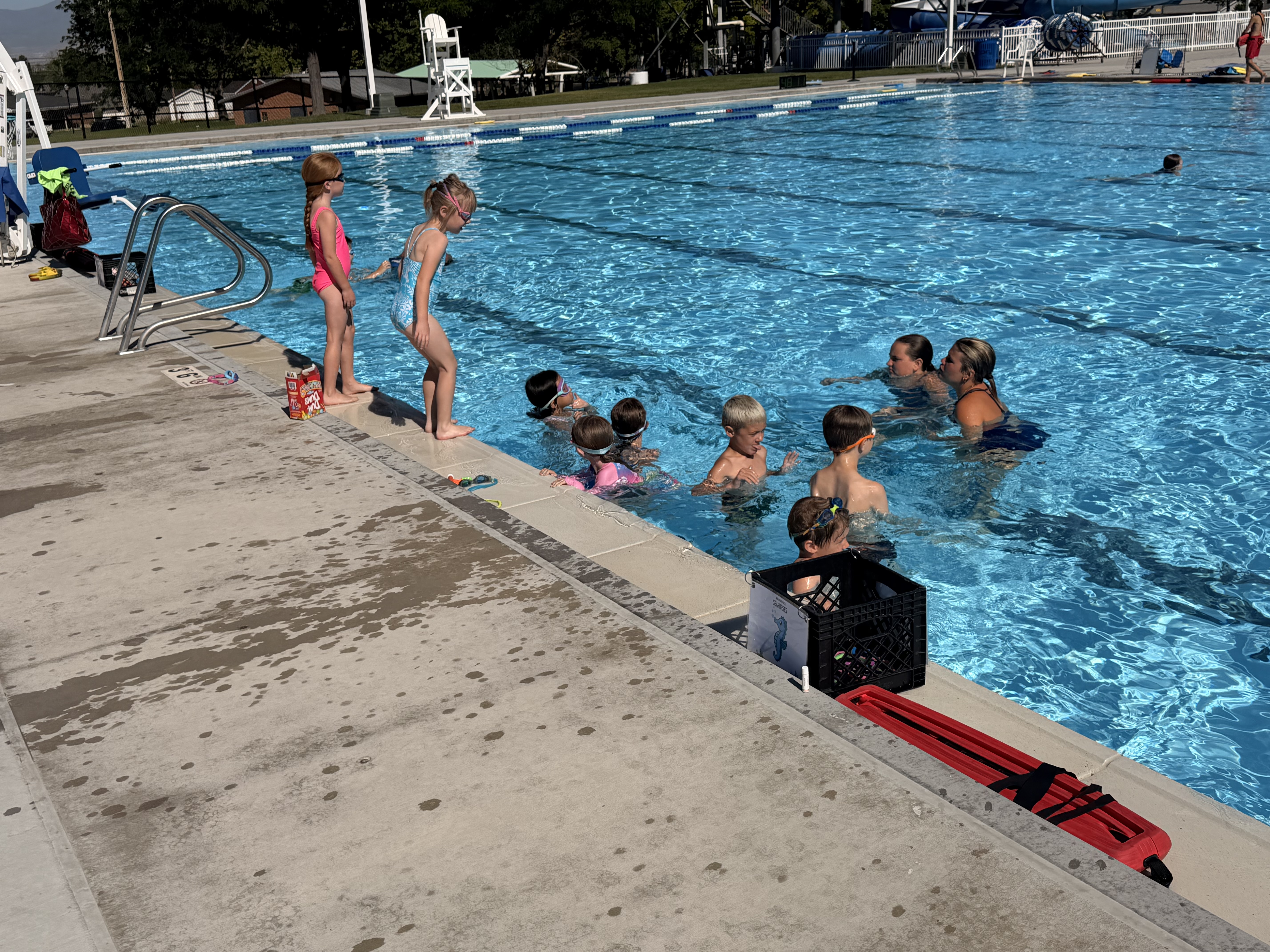 Swim lesson with instructors in the water