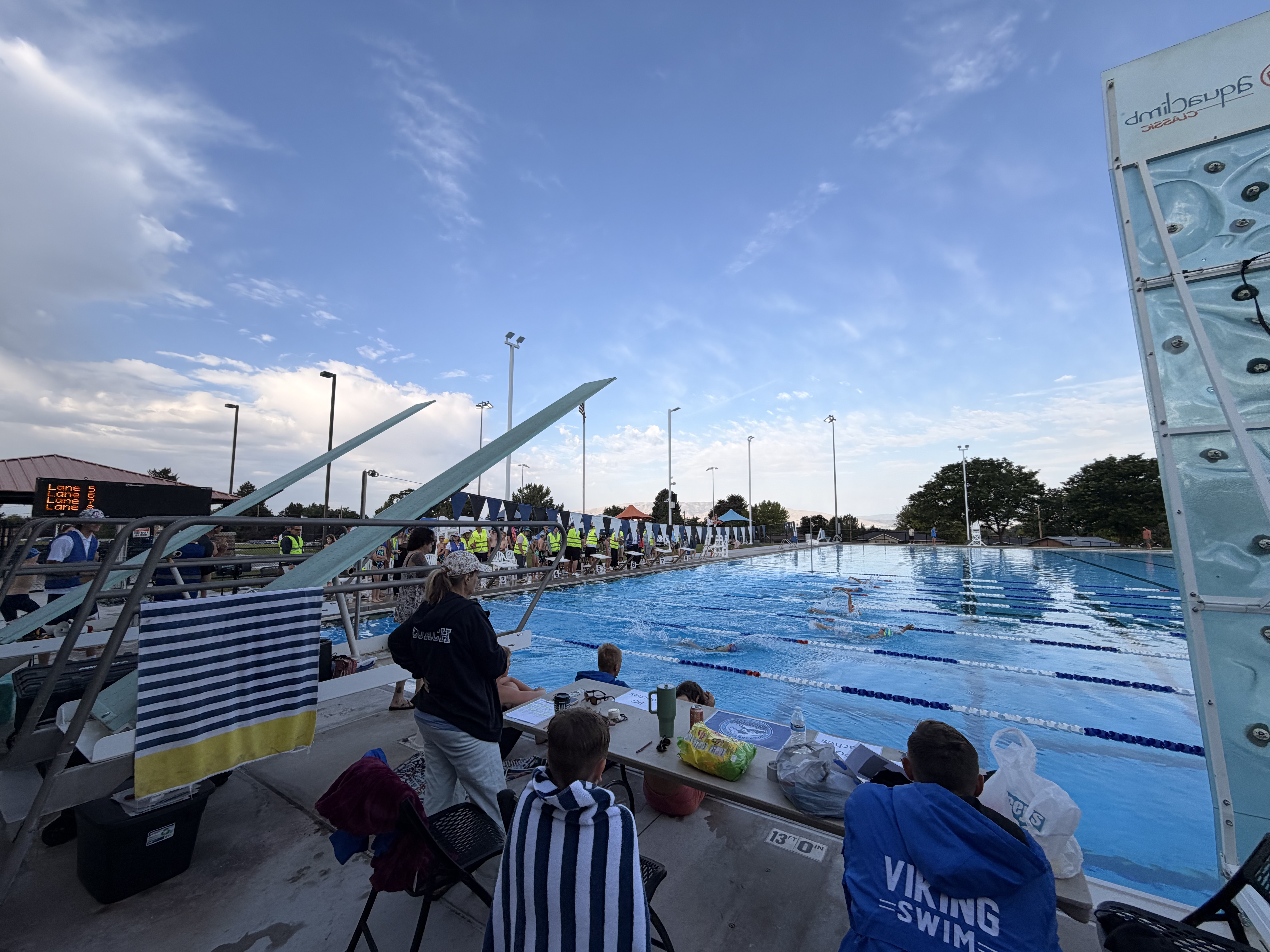 Swim team practice with coaches at the pool
