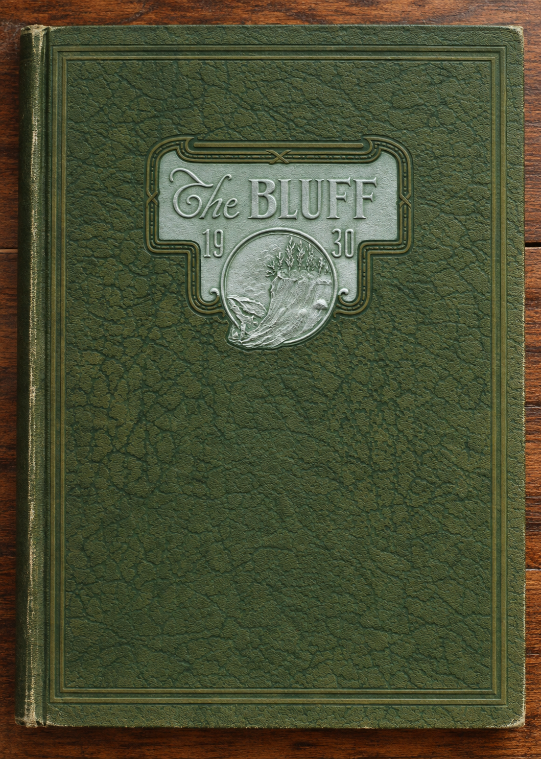 Embossed green textured cover of the 1930 Poplar Bluff High School yearbook titled The Bluff