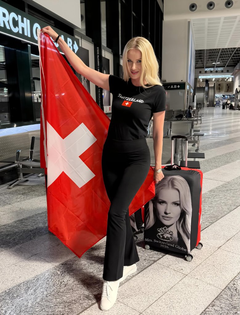 Alena Khlapkova at the airport with Swiss flag