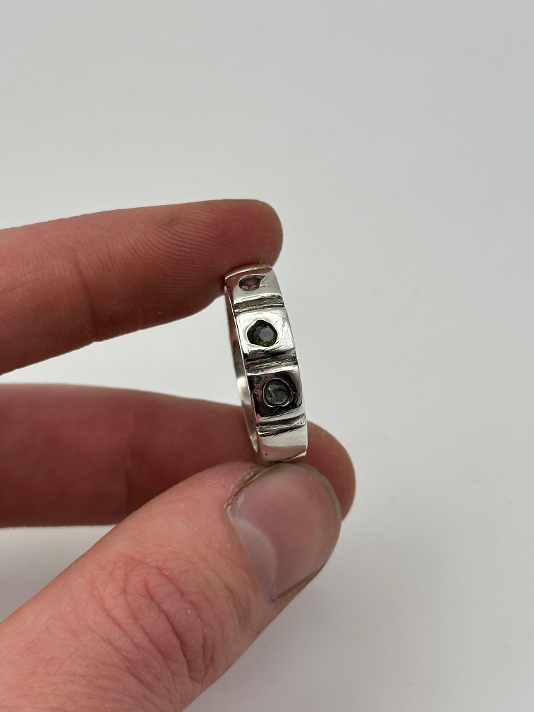 Silver band with multi-color gemstones