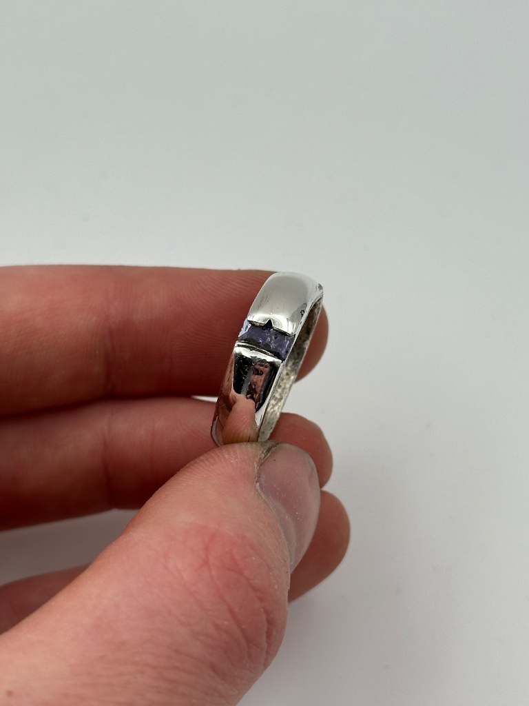 Silver band with purple stone