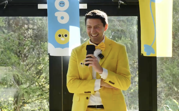 KEVPOP laughing while holding a microphone