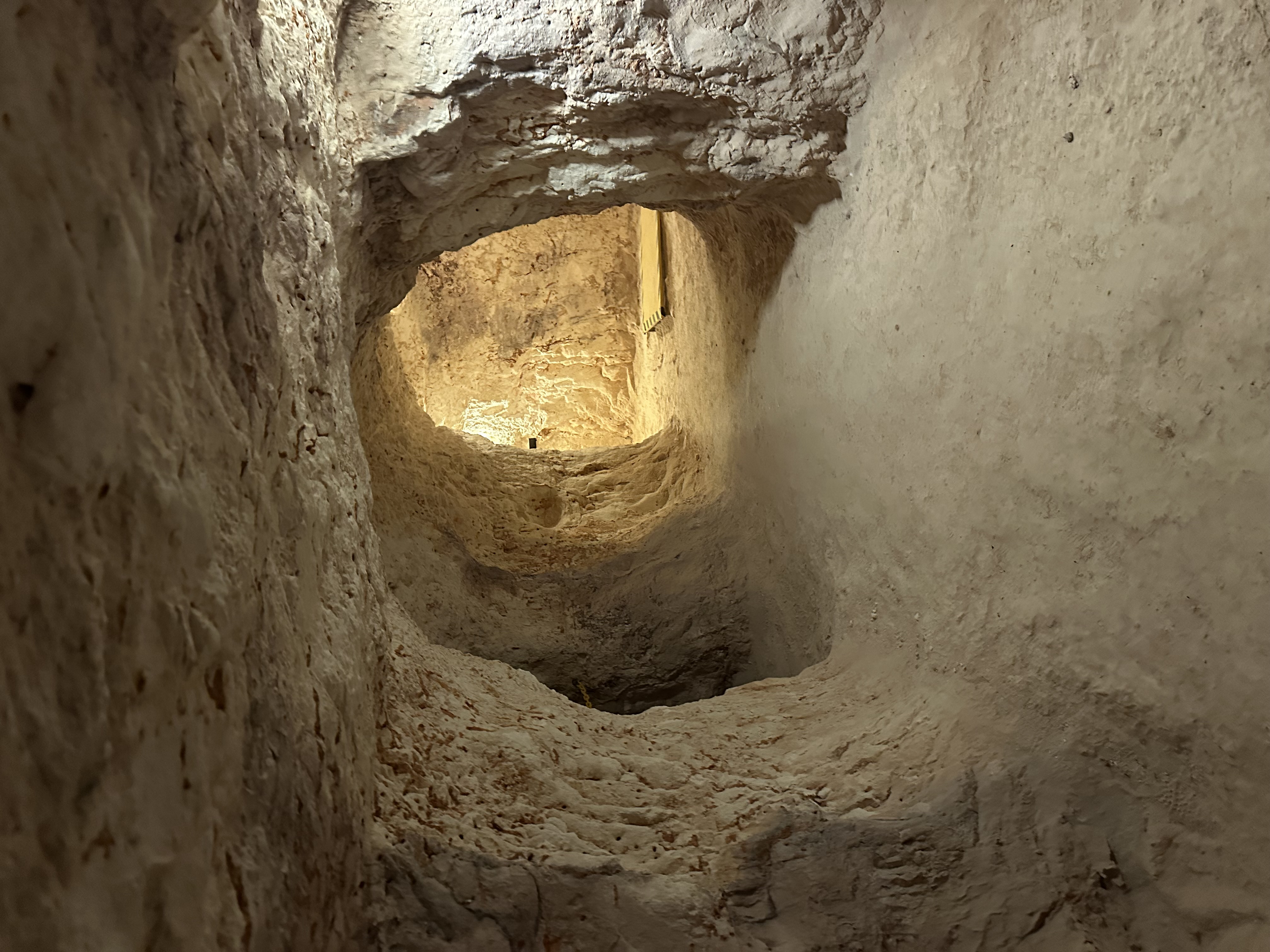 Light and ventilation shafts cut straight through the rock above a dugout
