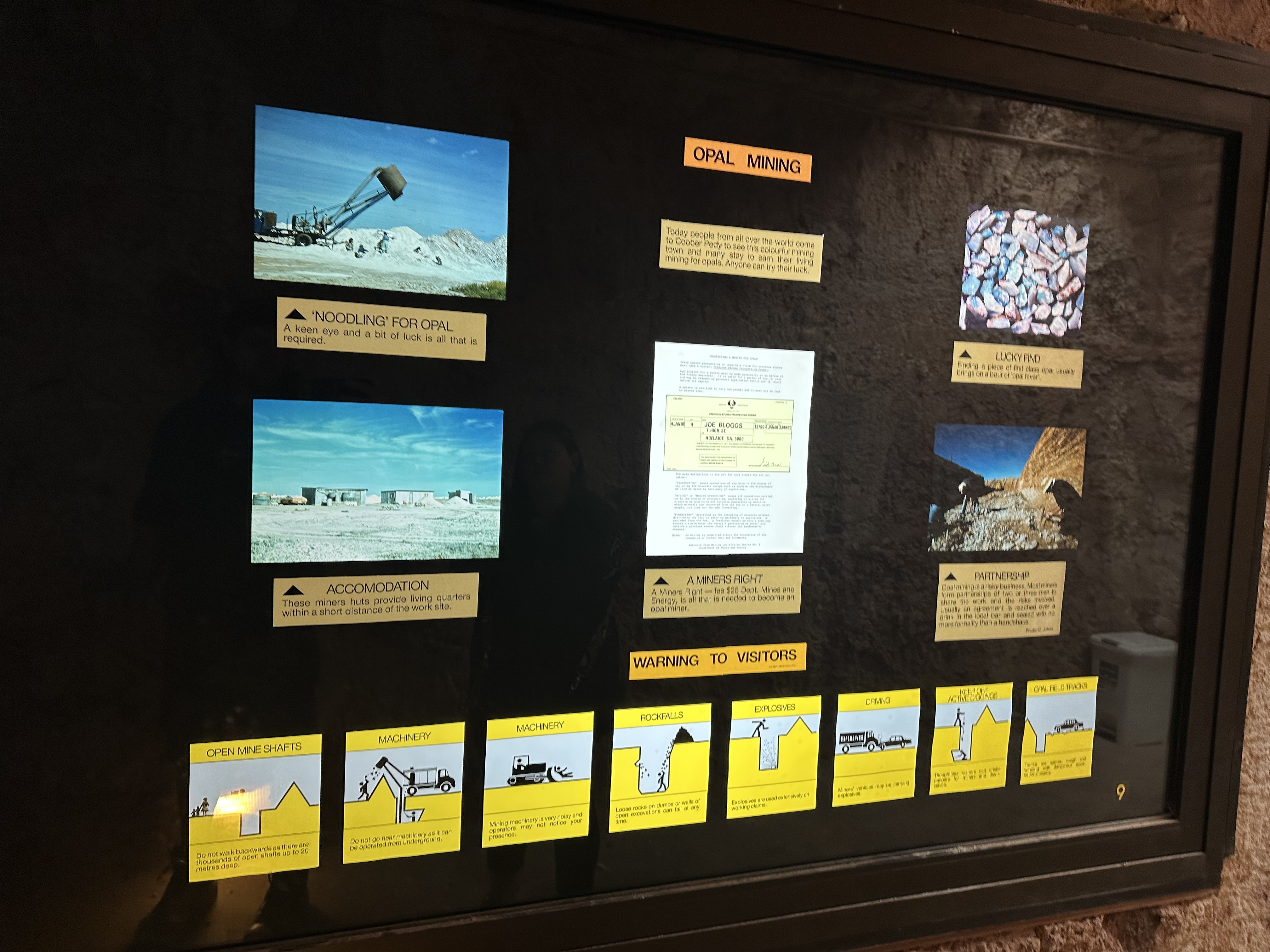Warnings to visitors around the opal fields — open shafts, machinery and active diggings