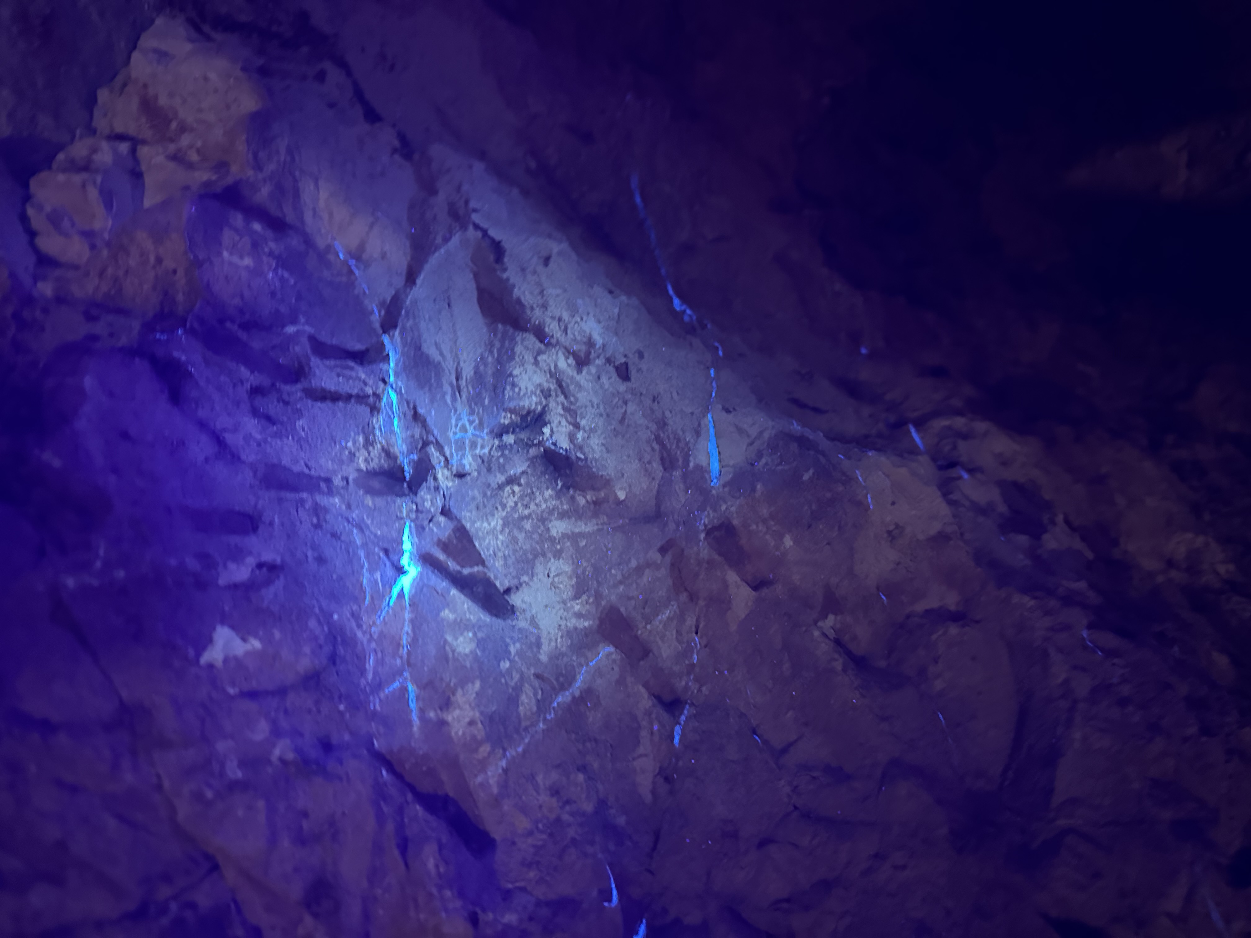 Opal seams lighting up under the black light
