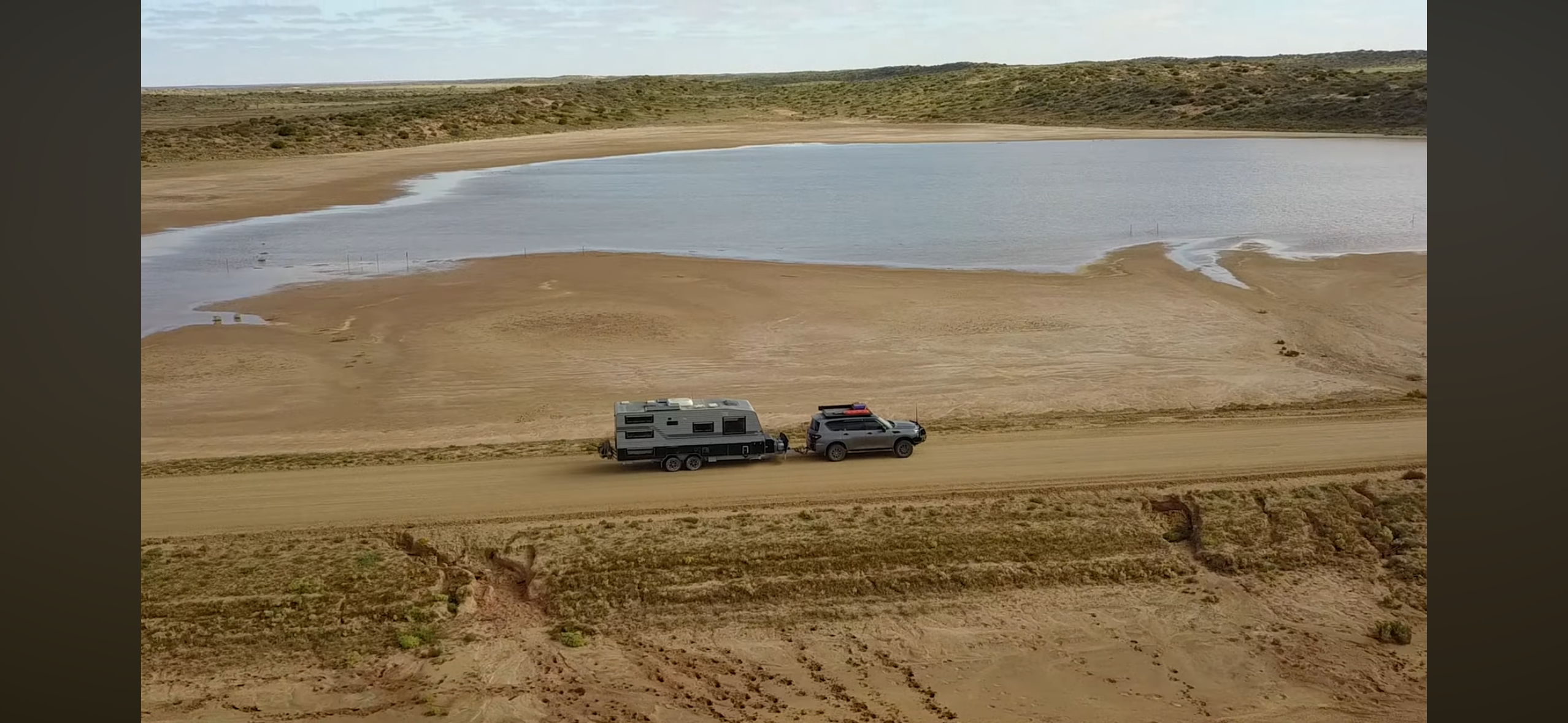 Our caravan and 4WD on a dusty outback track