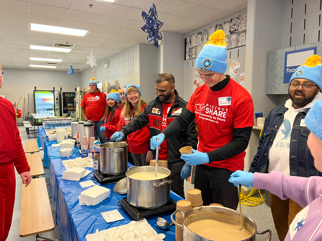 Project SHARE volunteers serving food
