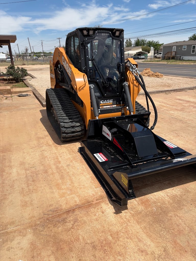 Skid steer with attachment