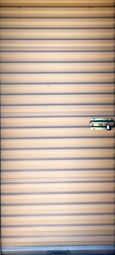 Storage unit door with lock