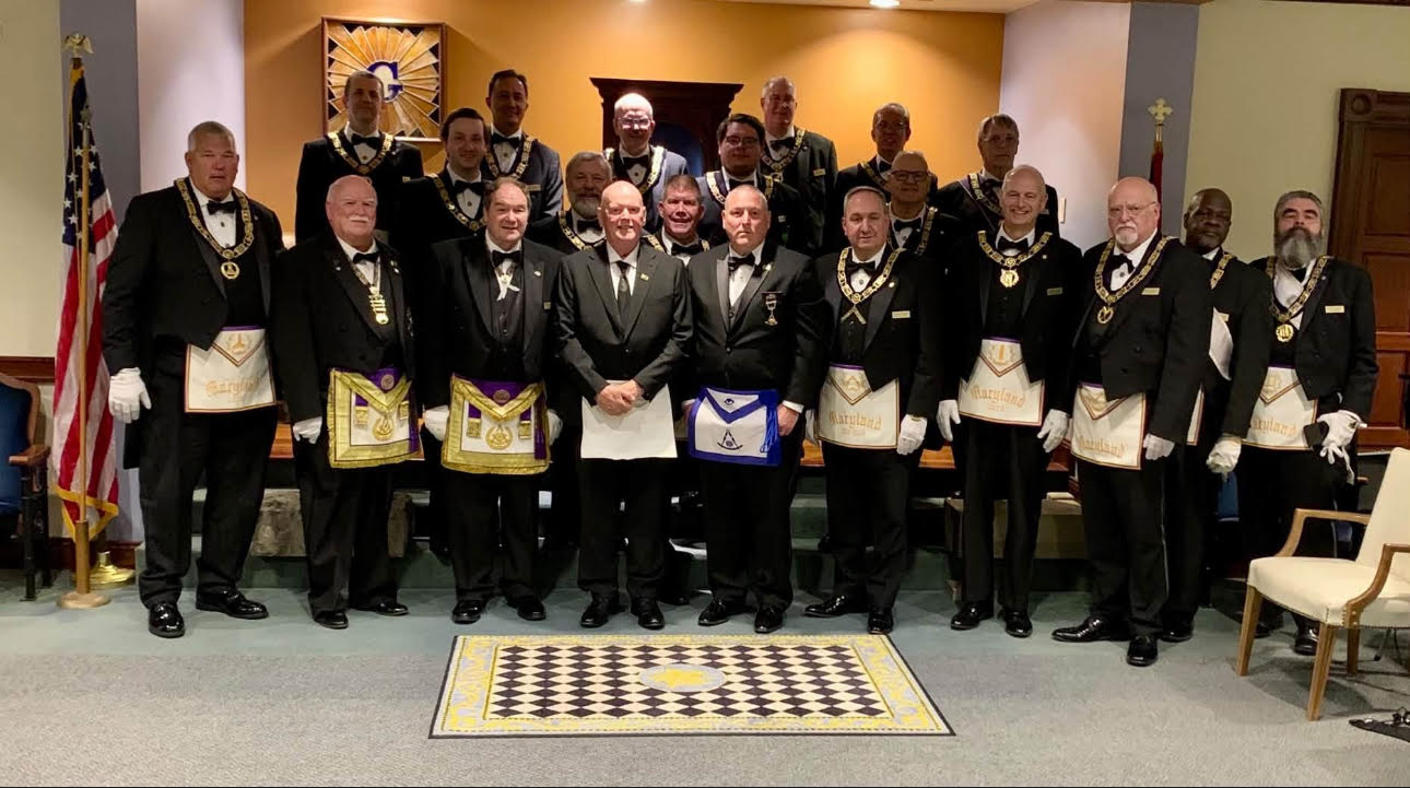 Brother Al Morgan with Most Worshipful Grand Master Randall L. Watson and the Grand Line officers at Pickering Lodge