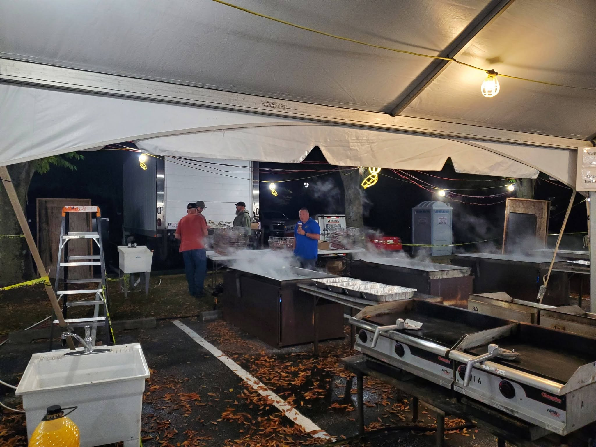 Volunteers cooking under the tent at Harvest Home Day on October 3, 2026