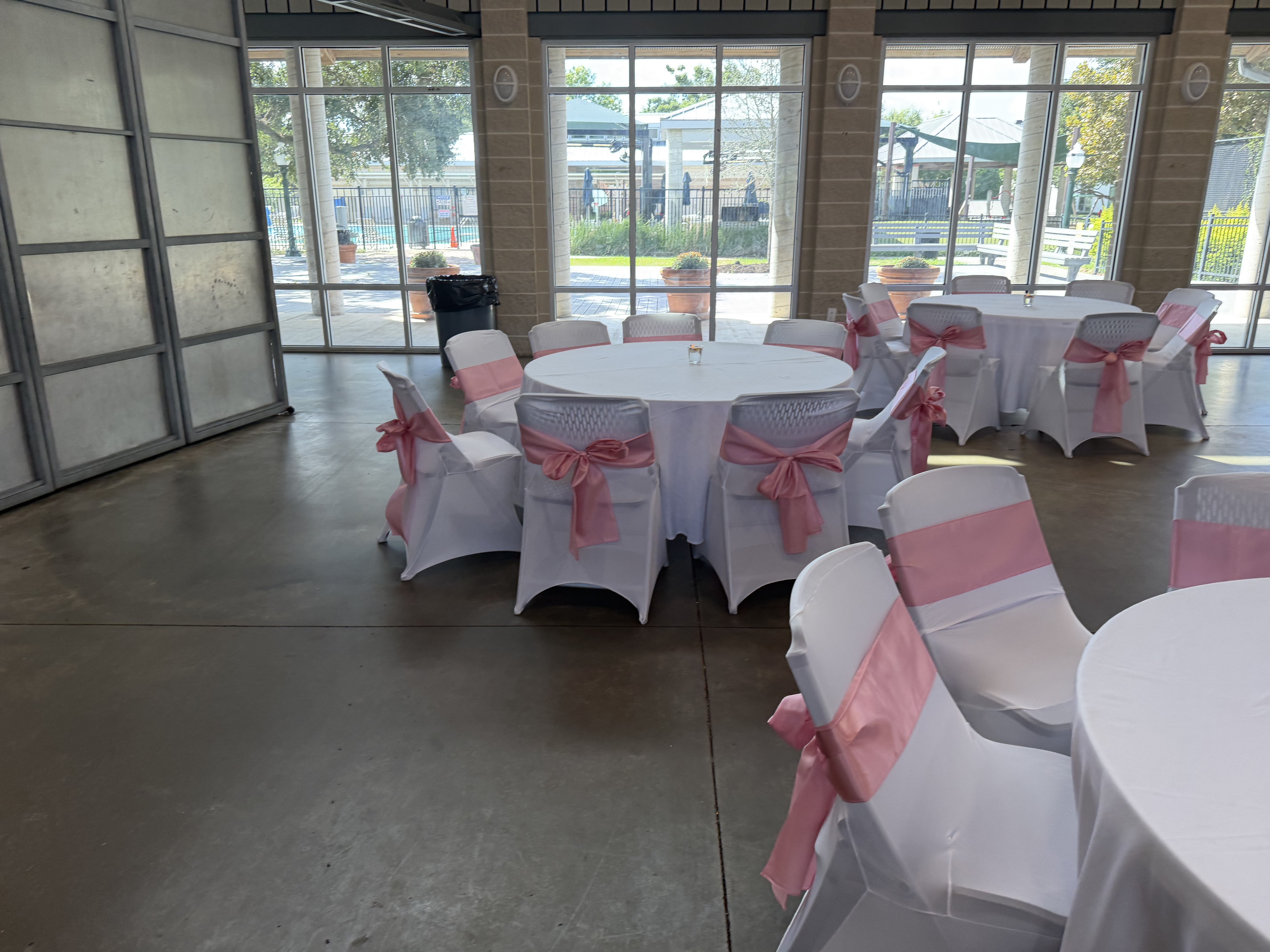 Round tables with blush satin sashes — reception-ready 🤍