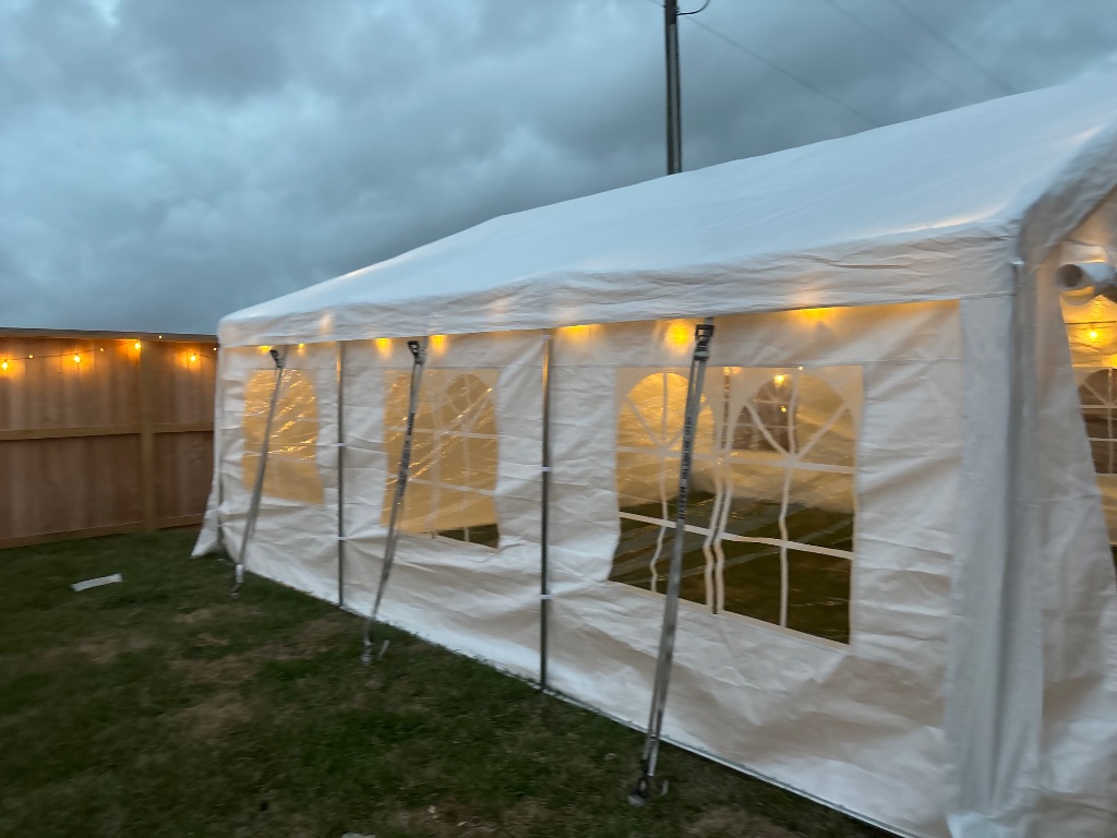 Double canopy tents with tables on green lawn ☀️