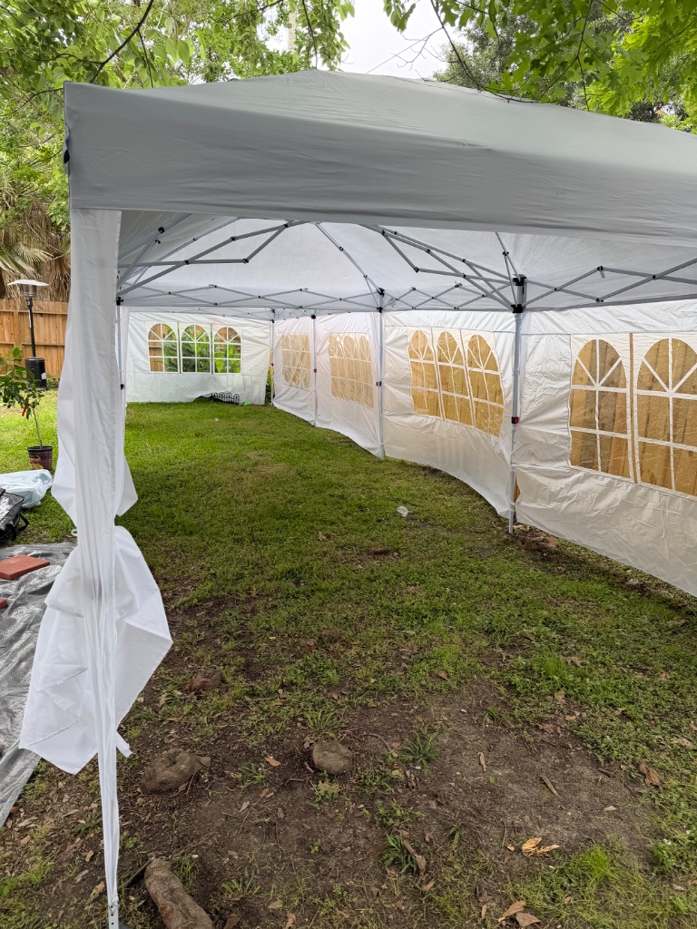 Majestic white tent on open lawn — spacious & weather-proof ⛺