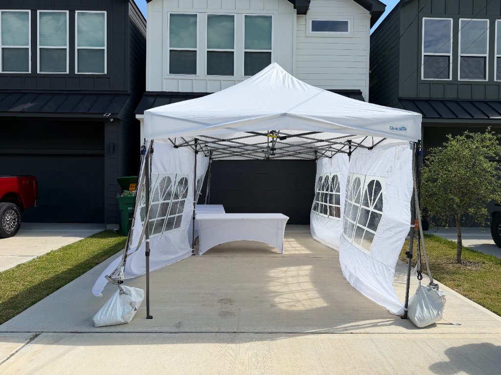 Pop-up canopy with arched windows & sandbag anchors ⛺