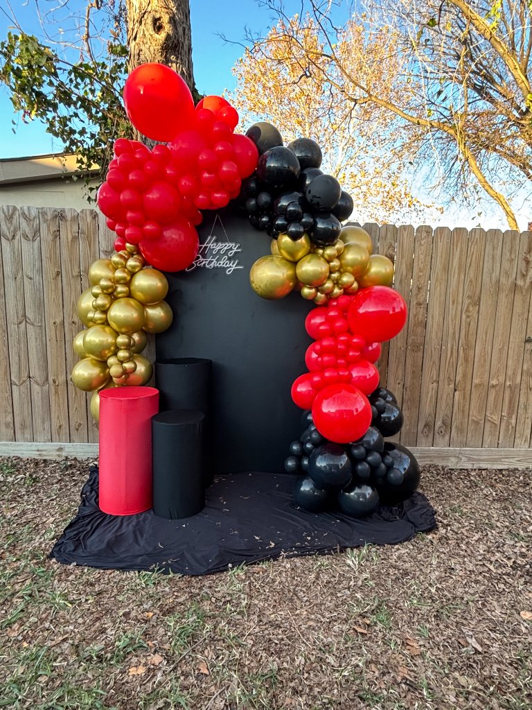 Red, black & gold garland arch — sleek birthday backdrop 🎉
