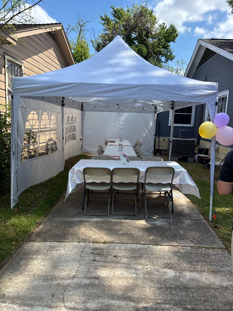 Canopy with long banquet table — backyard party perfection 🎈