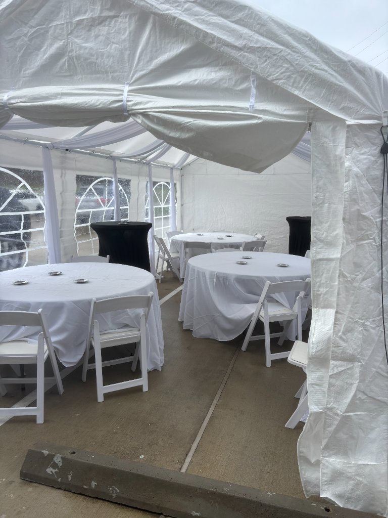 All-white draped tent — cocktail tables & turf luxury 🕊️