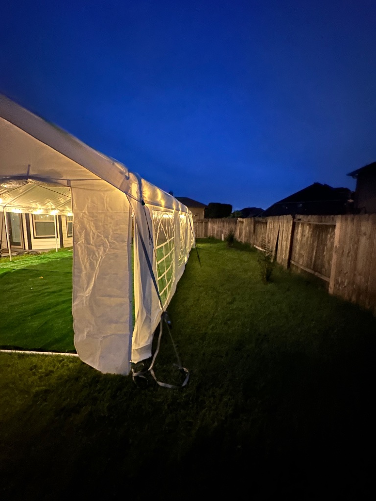 White tent glowing at dusk — enchanting evening setup 🌙
