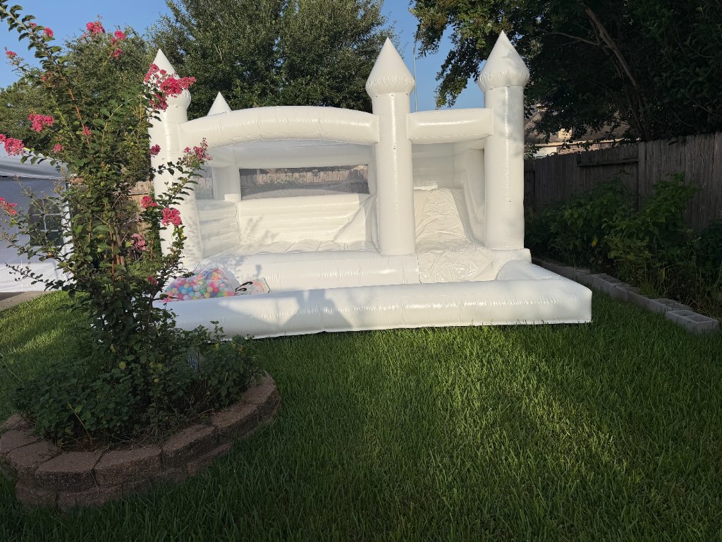 All-white bounce castle with ball pit — crape myrtle charm 🏰🌸